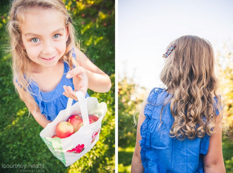 Girl showing her bag of apples
