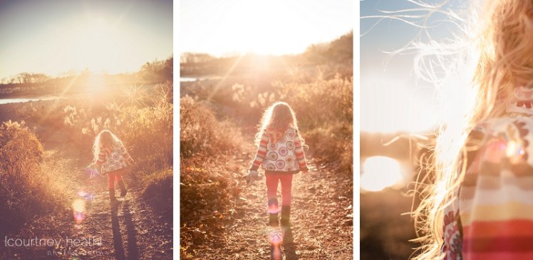 Girl with long curly hair walking into the sunset