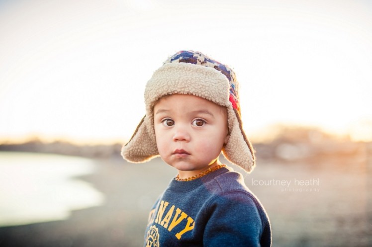 Young boy with brown eyes wearing pilot hat