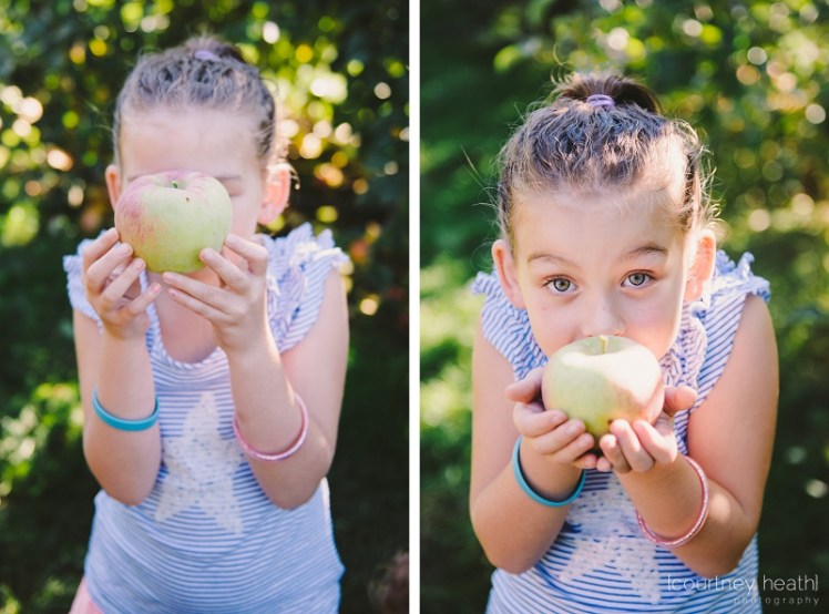 Young girl holding a green apple